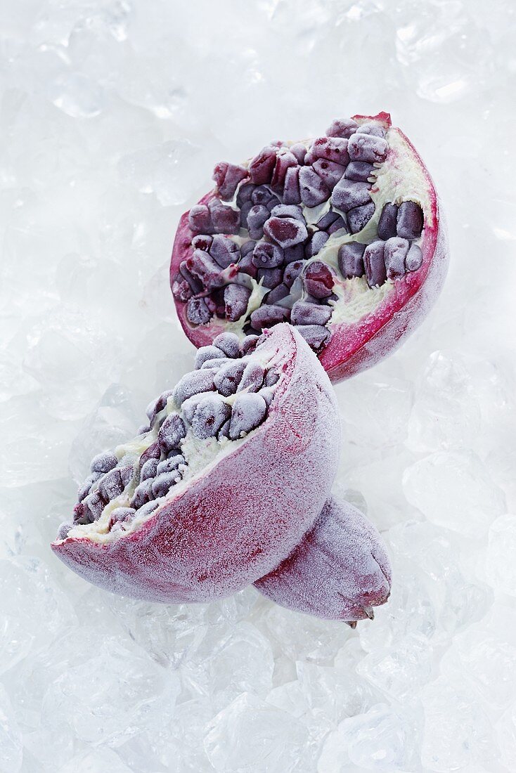 A frozen pomegranate, halved