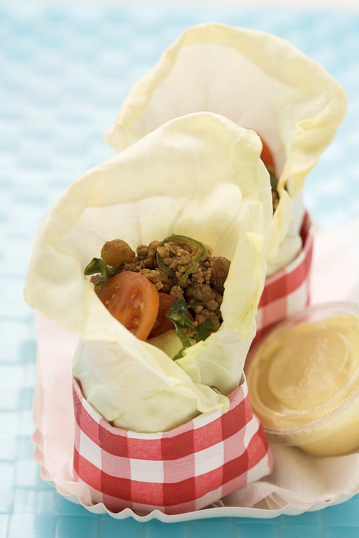 Serbian white cabbage wraps with minced meat and tomatoes