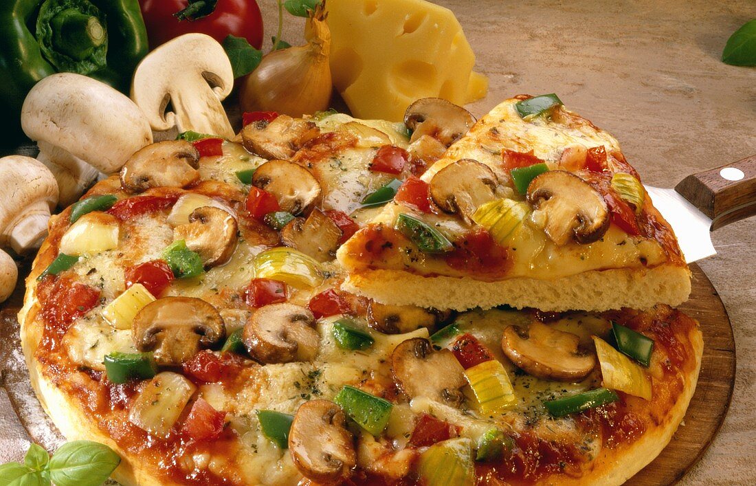 Pizza with mushrooms, peppers, onions and cheese