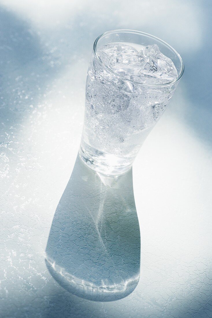 Glass of mineral water with ice cubes