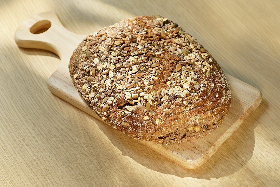 Wholemeal bread on a small wooden board