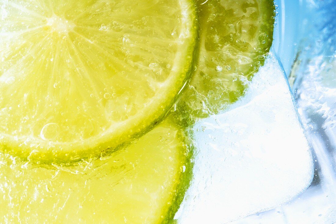 Slices of lime with ice cubes in a drink