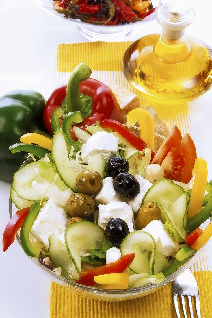 Vegetable salad with pieces of feta cheese and olives