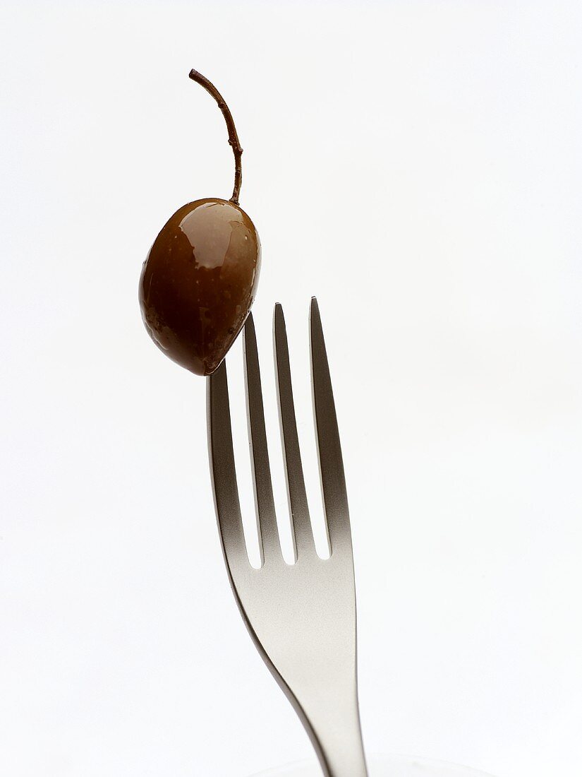 Olive speared on fork