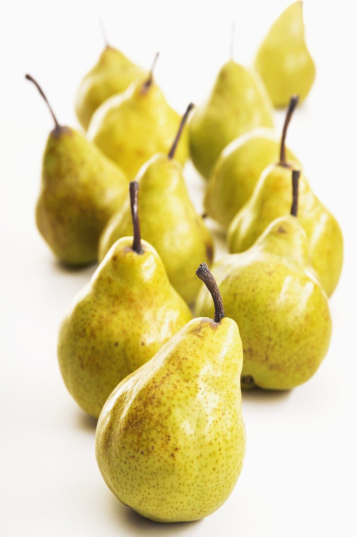 Several pears standing one behind the other