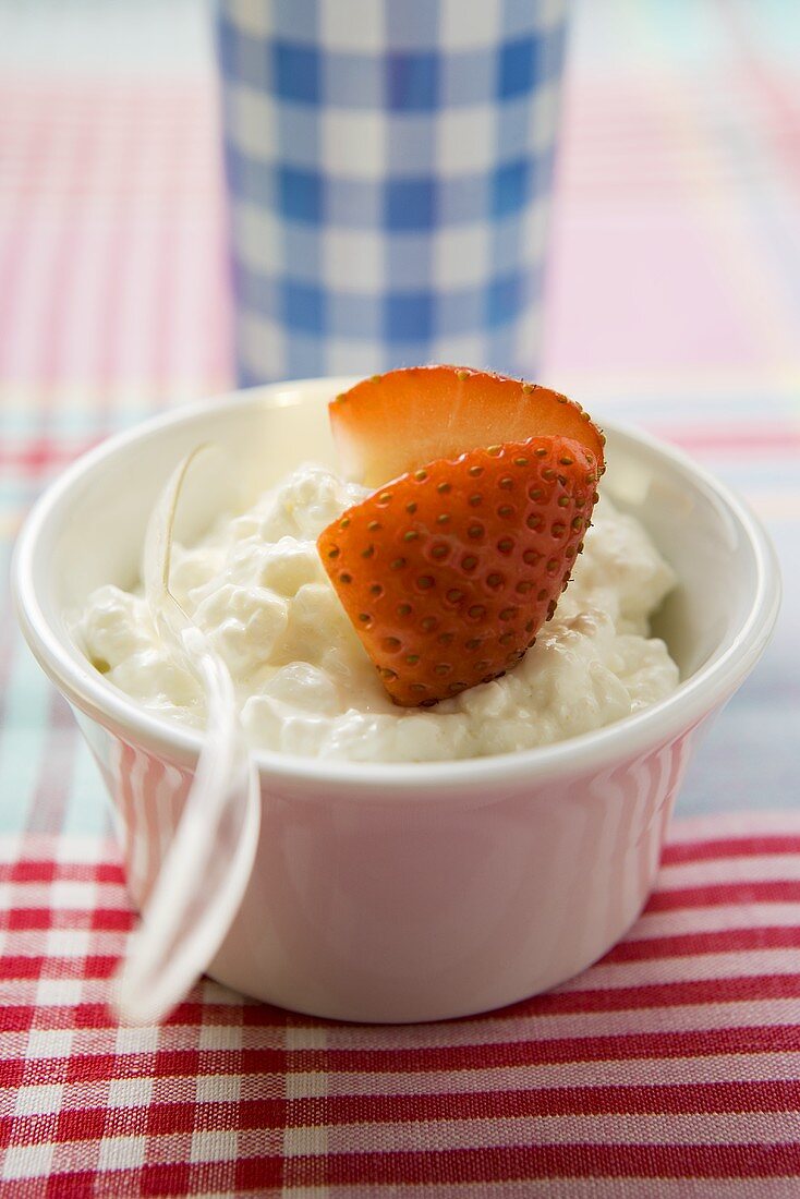 Cottage and strawberry in a small bowl