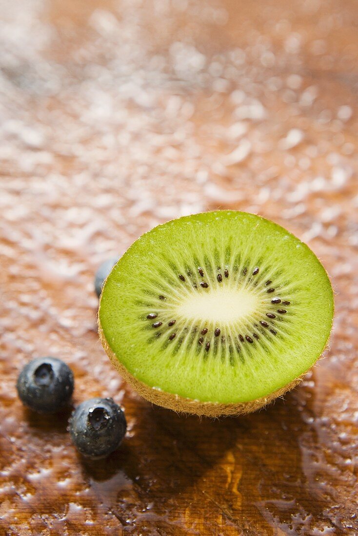 Blueberries and half a kiwi fruit