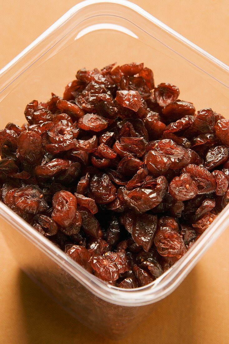 Dried cranberries in plastic container
