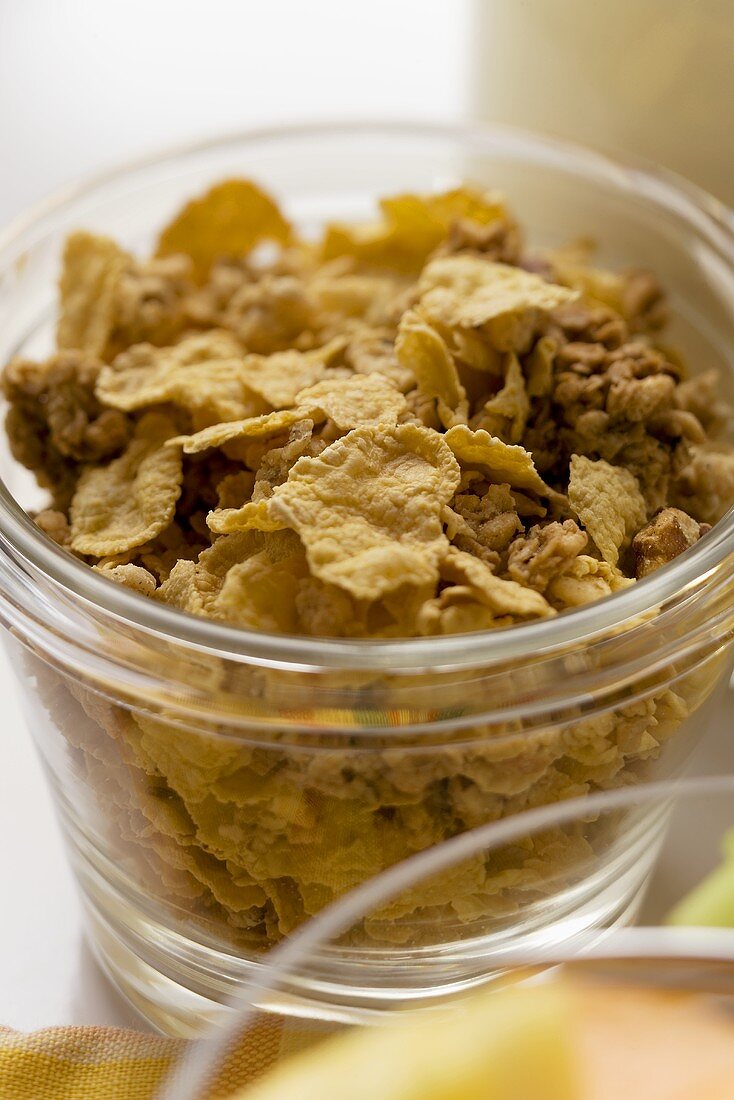 Mixed cereal flakes in a glass bowl