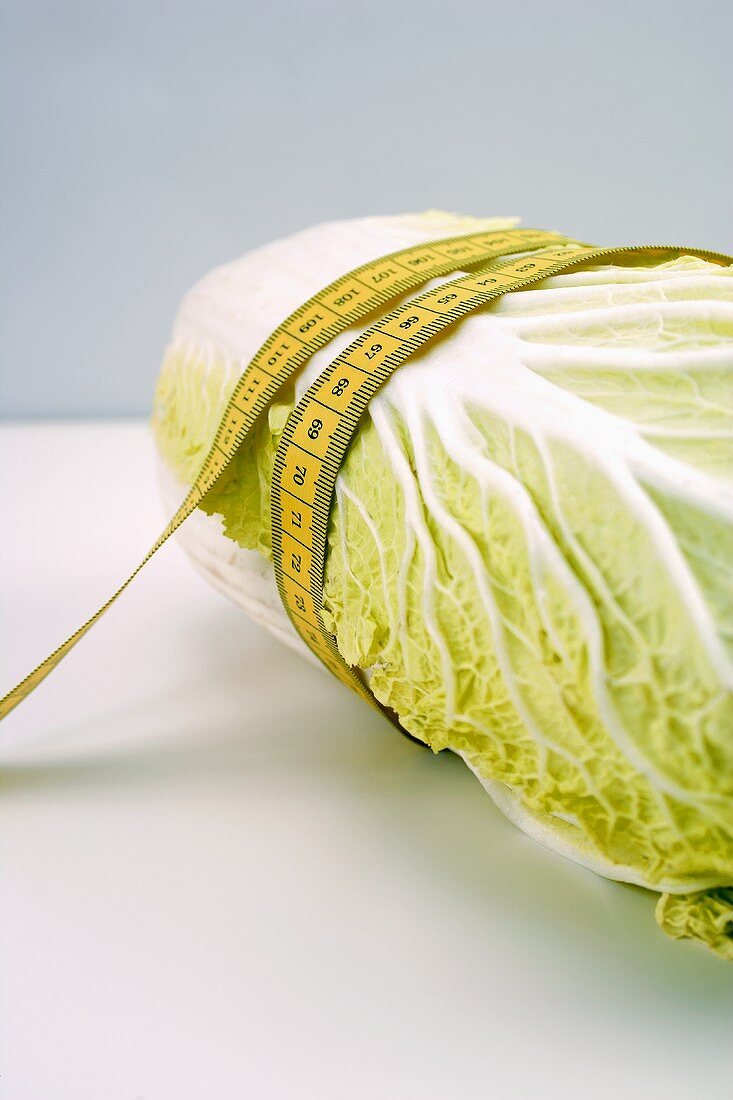 Chinese cabbage with tape measure around it