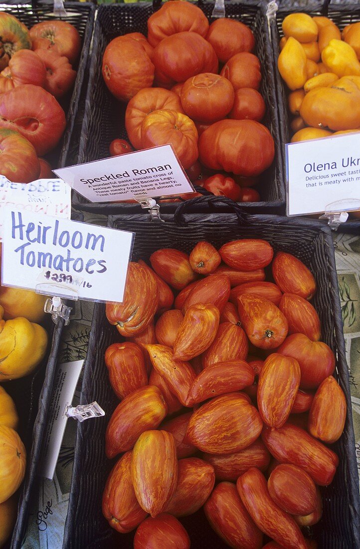 Baskets of Heirloom Tomatoes at a Market