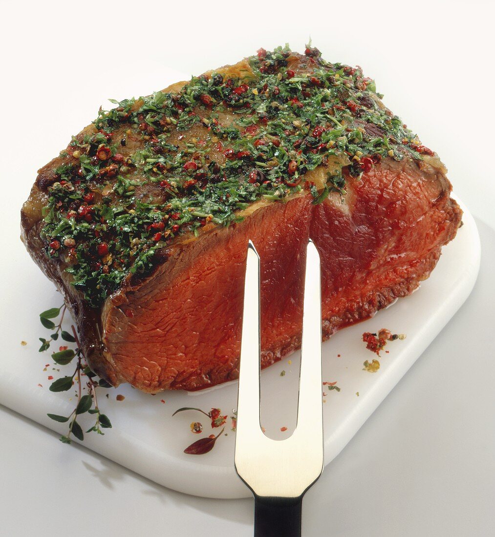 A piece of beef fillet with herb crust