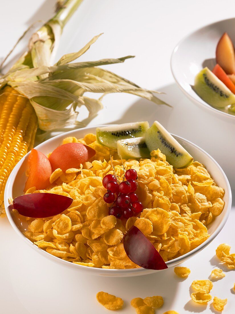 A bowl of cornflakes with fresh fruit