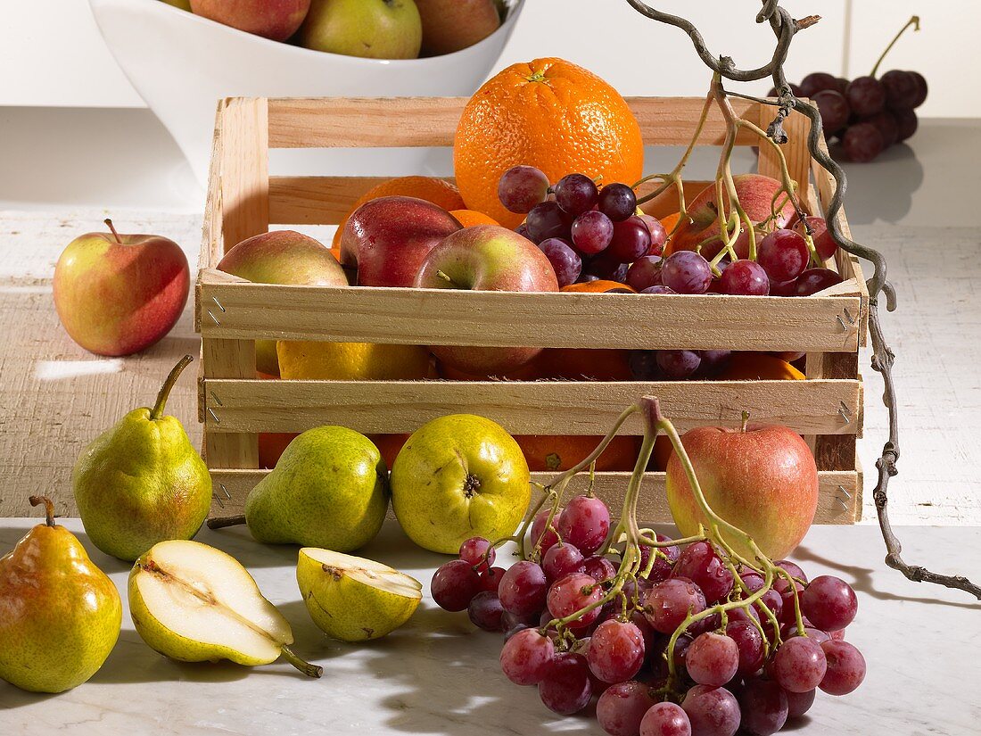 Still life with fruit in a wooden box