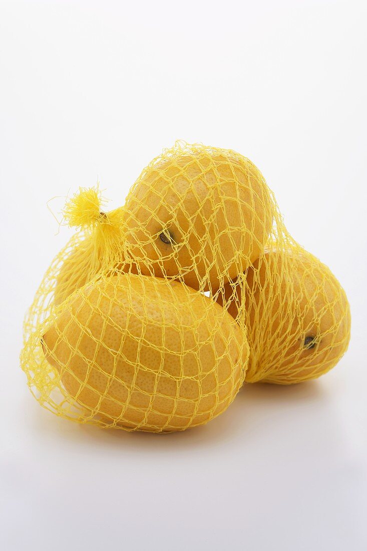 Four lemons in a net