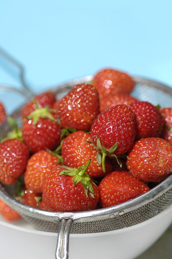 Fresh strawberries in a sieve