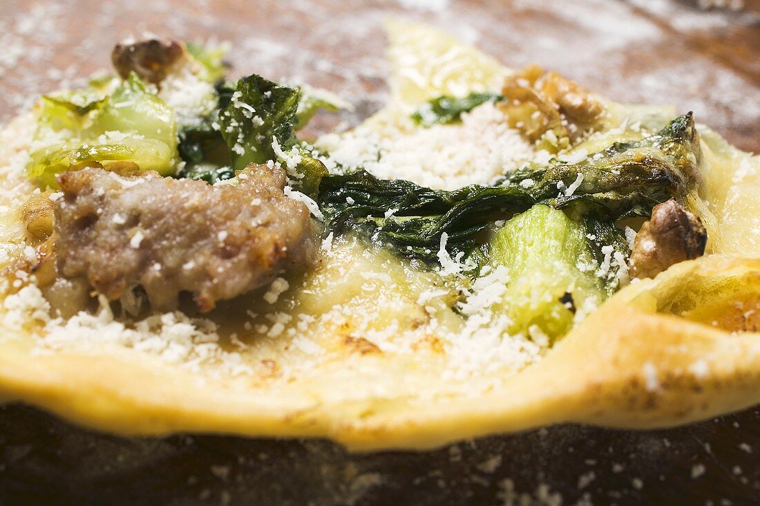 Remains of flatbread with mince, chard and Parmesan