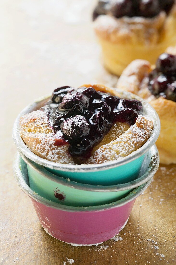 Individual bread puddings with cherries & icing sugar