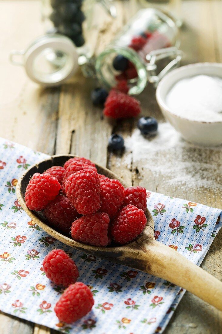 Fresh raspberries on a wooden spoon