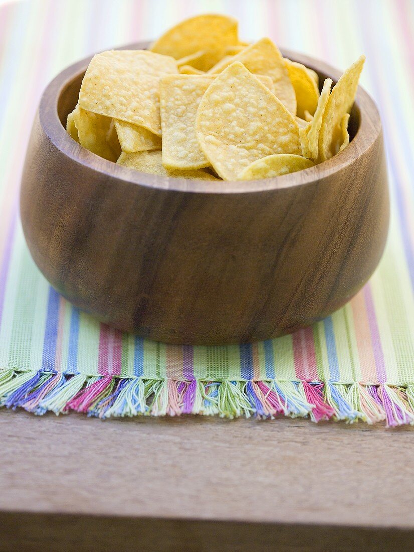 Tortilla chips in wooden bowl