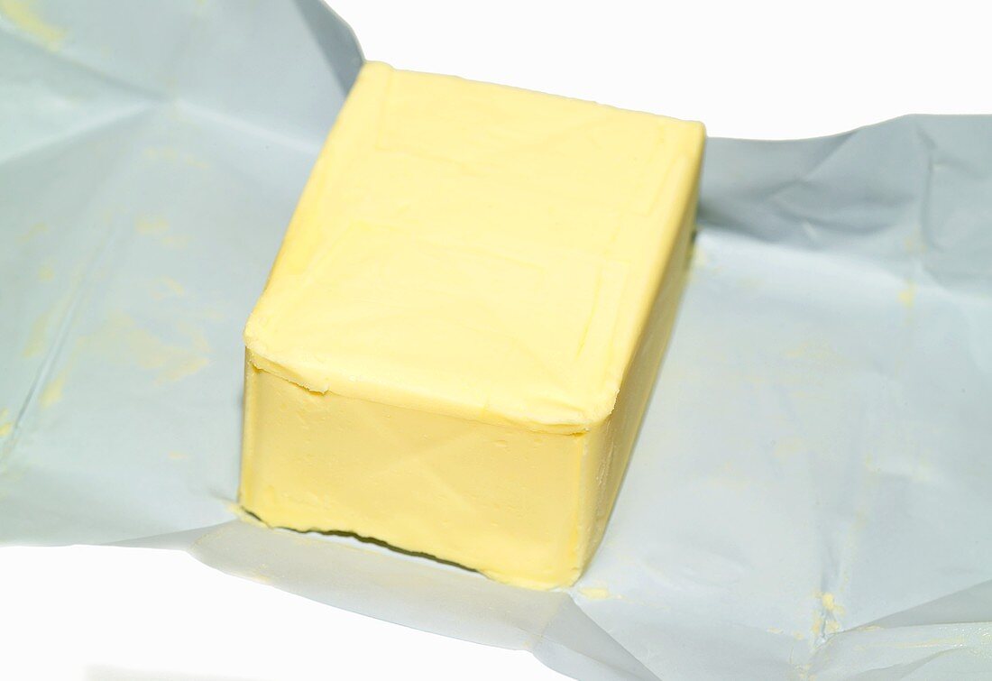 A block of butter on paper