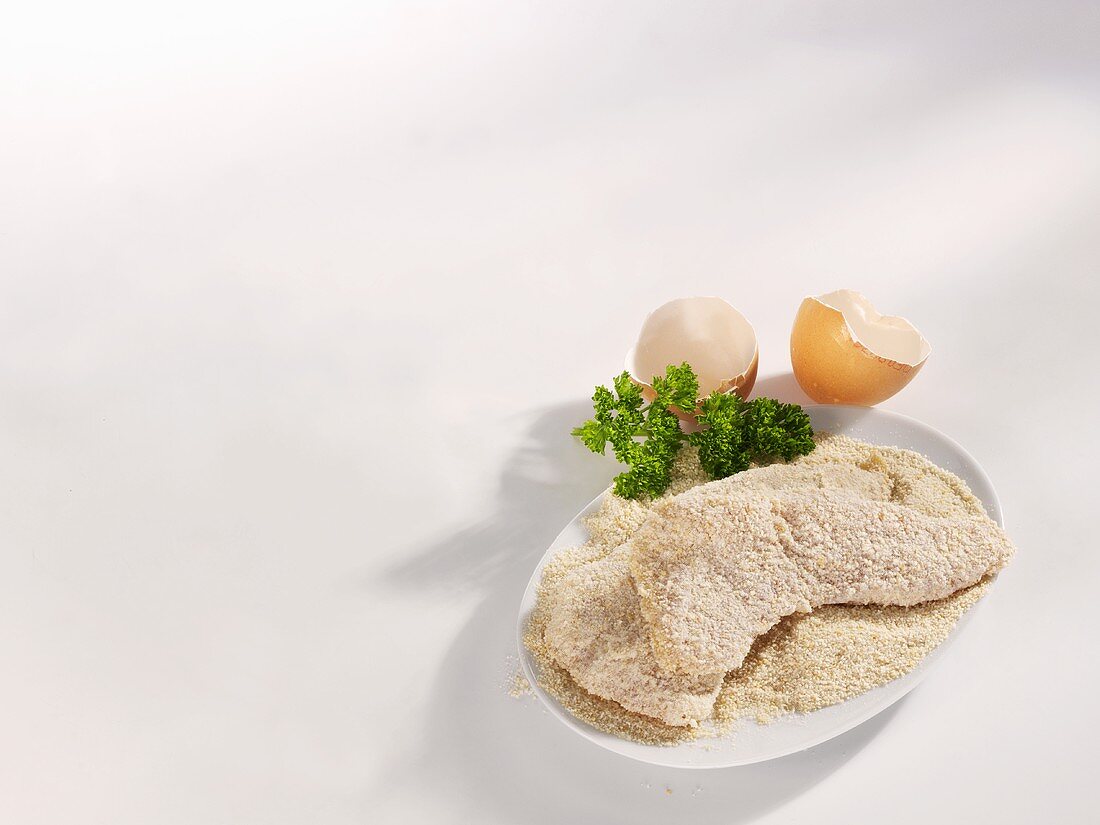 Raw, breaded Wiener Schnitzel (veal escalopes)