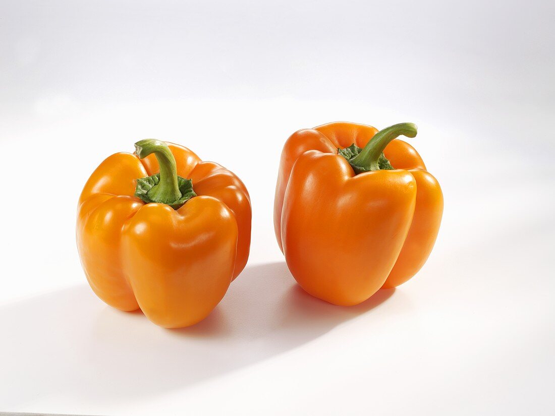 Two orange peppers