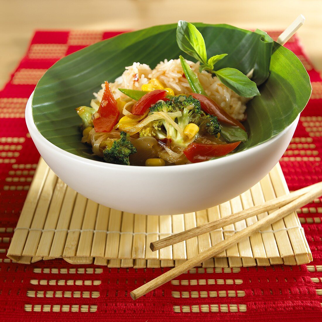 Vegetables and rice with banana leaf in a small bowl