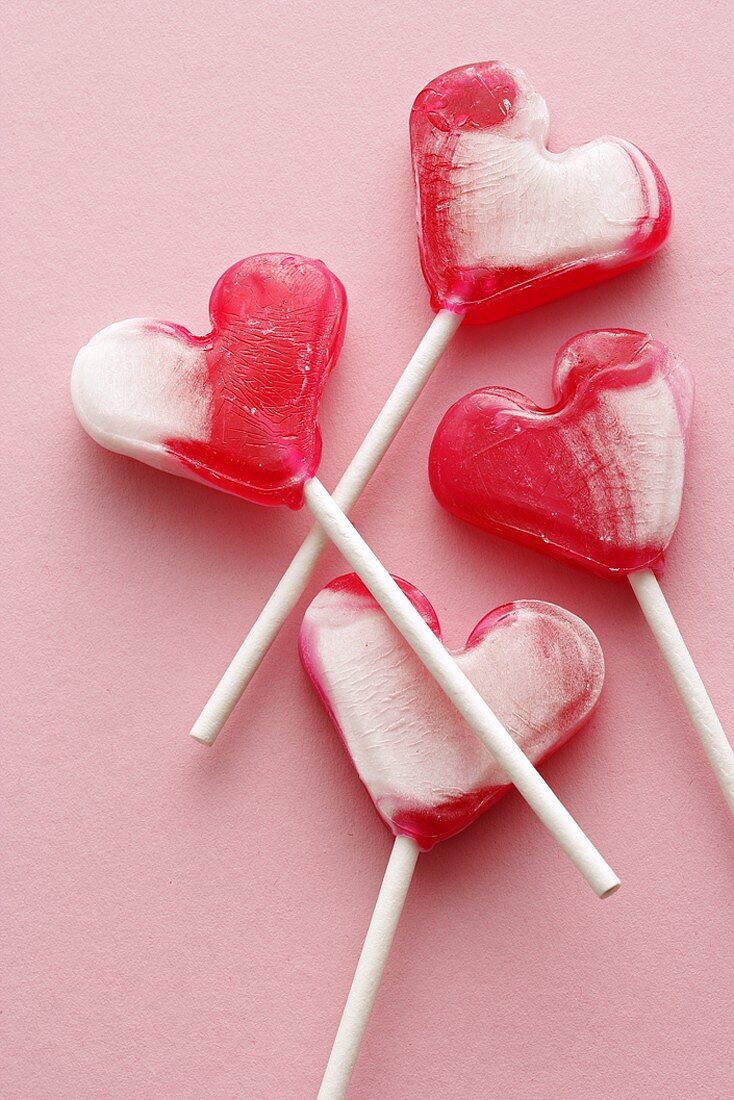 Four heart-shaped lollipops