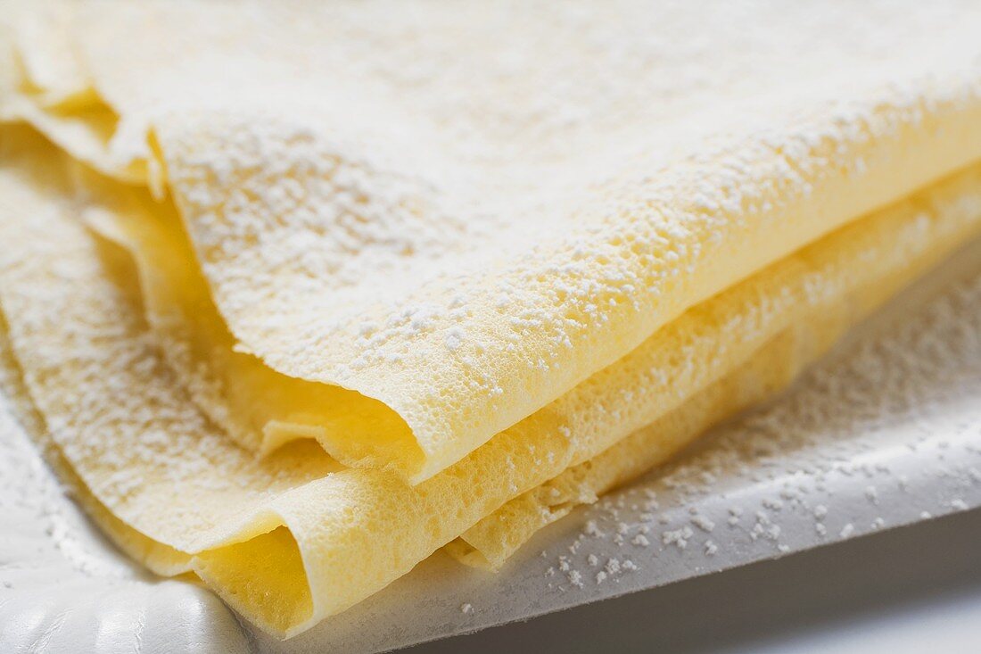 Freshly-made crêpes with icing sugar