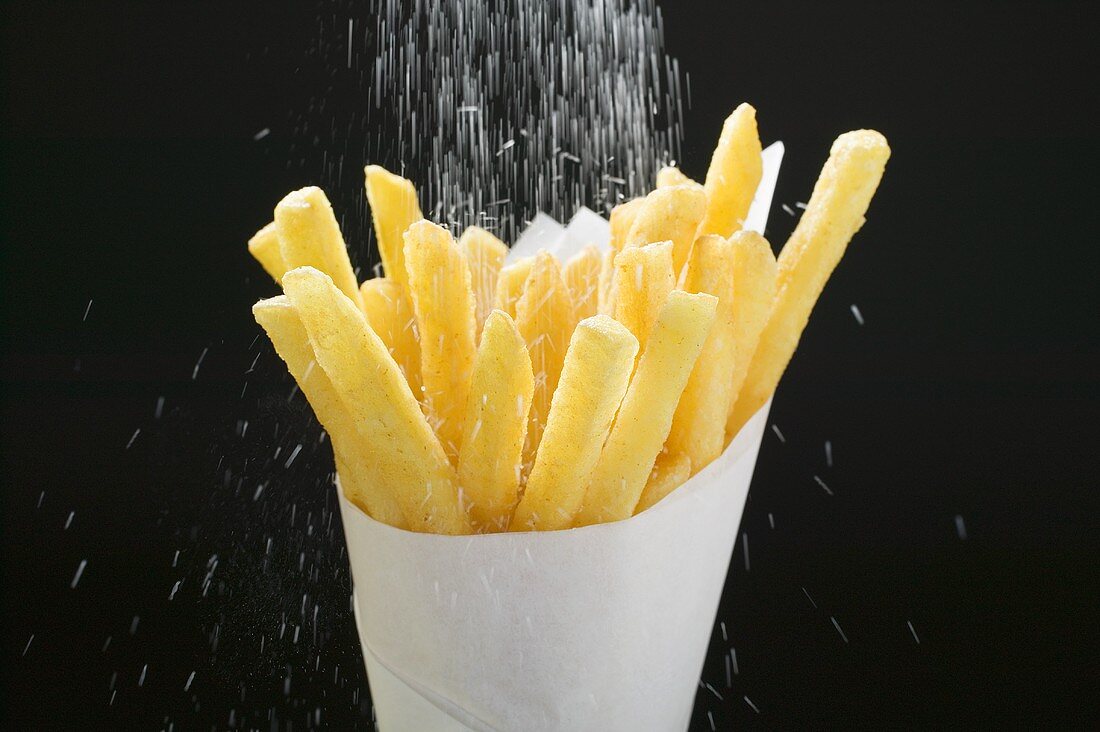 Sprinkling salt over chips