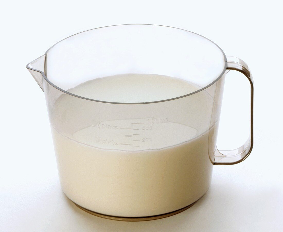 Fresh milk in a measuring jug