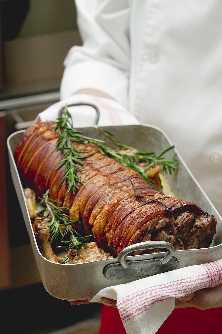 Boned and rolled saddle of suckling pig in a roasting dish