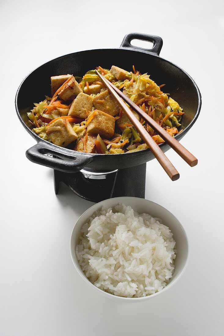 Stir-fried vegetables with fried tofu and rice