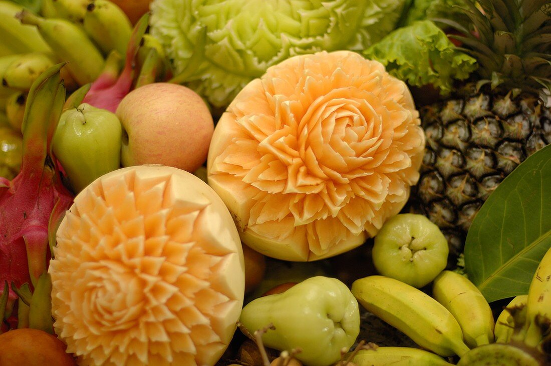 Carved melons among mixed fruit