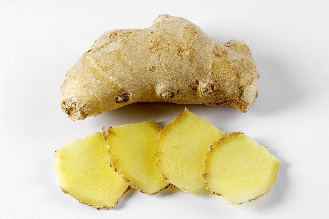 Fresh ginger root, whole and sliced