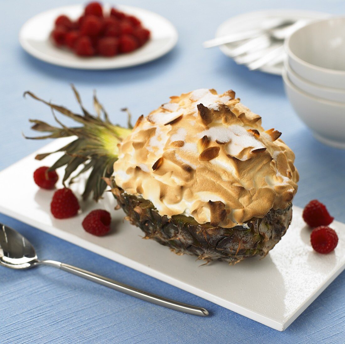 Vanilla ice cream & fruit under baked meringue in pineapple