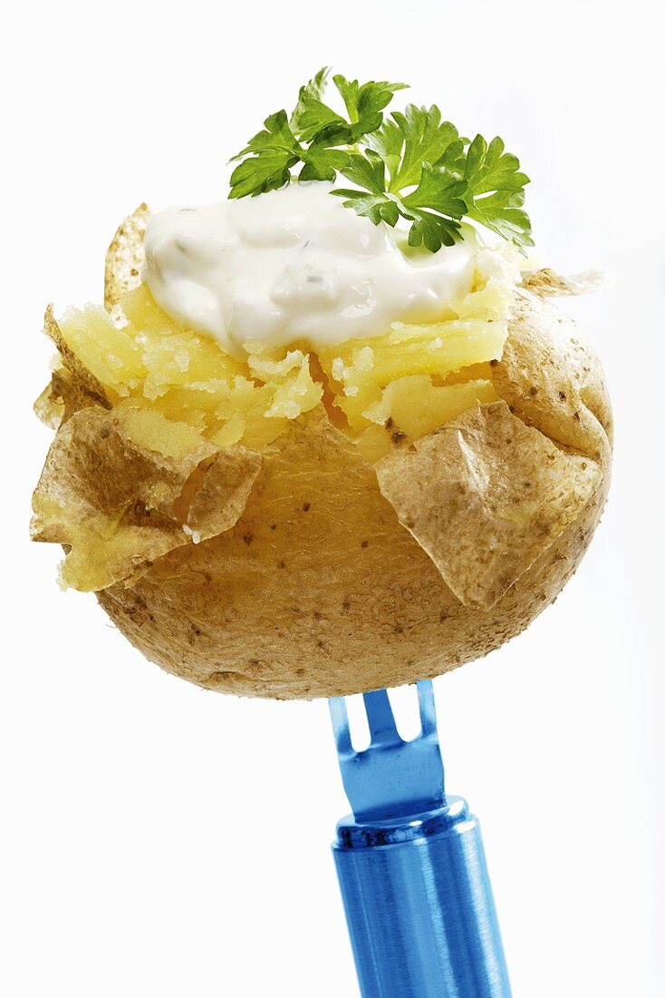 A baked potato with herb quark