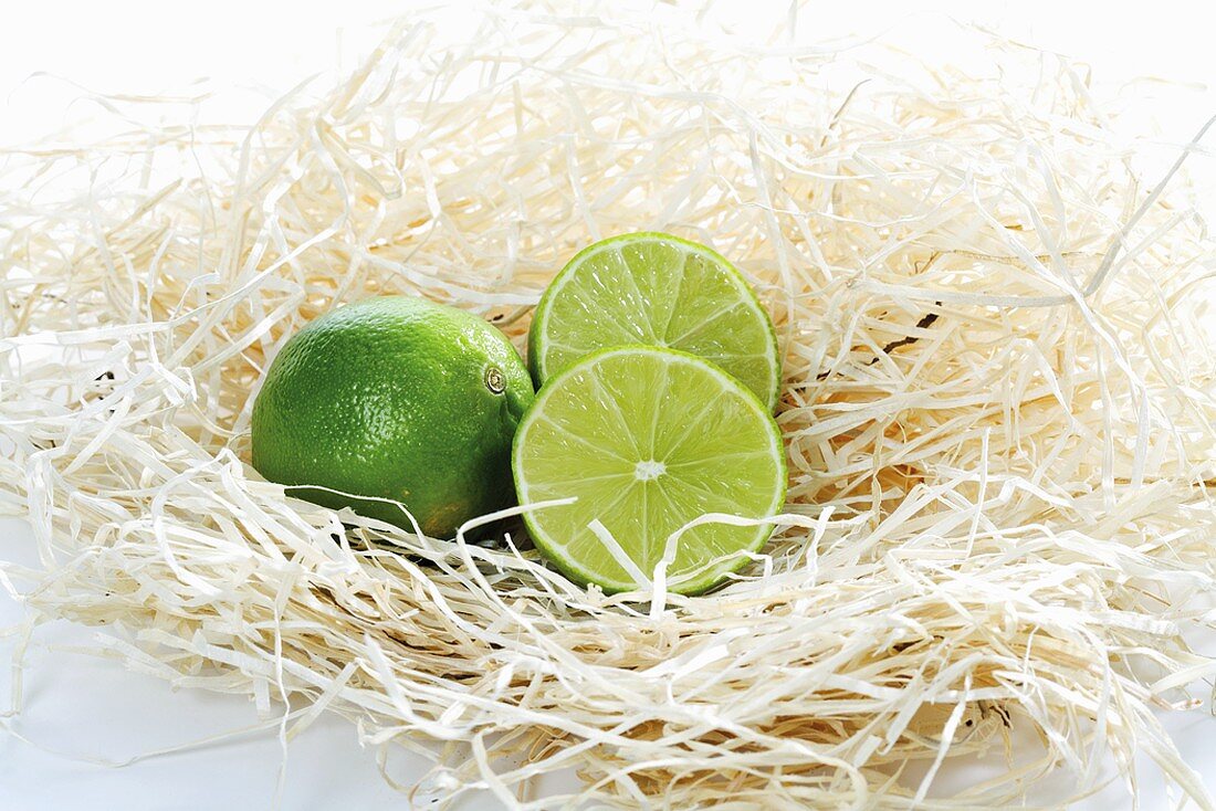 Whole and halved limes