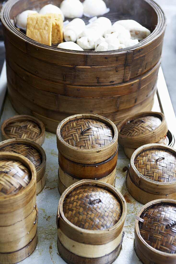 Steaming baskets and various types of Chinese dumplings