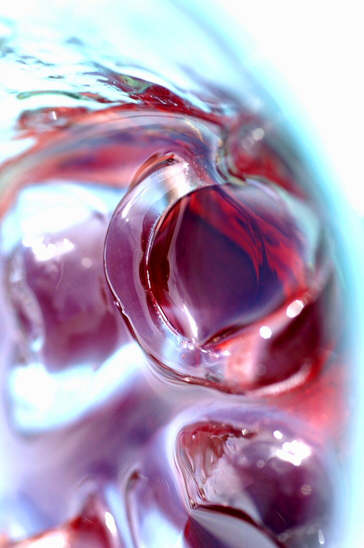 Ice cubes in a glass of fruit juice