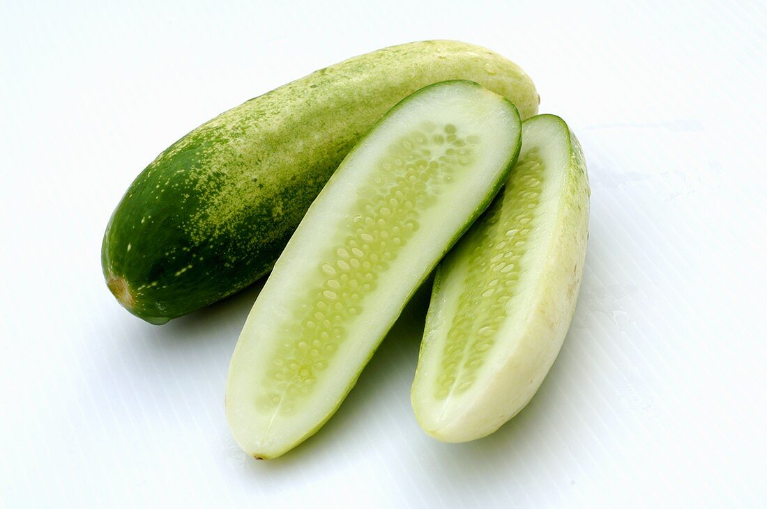 Whole and half cucumbers