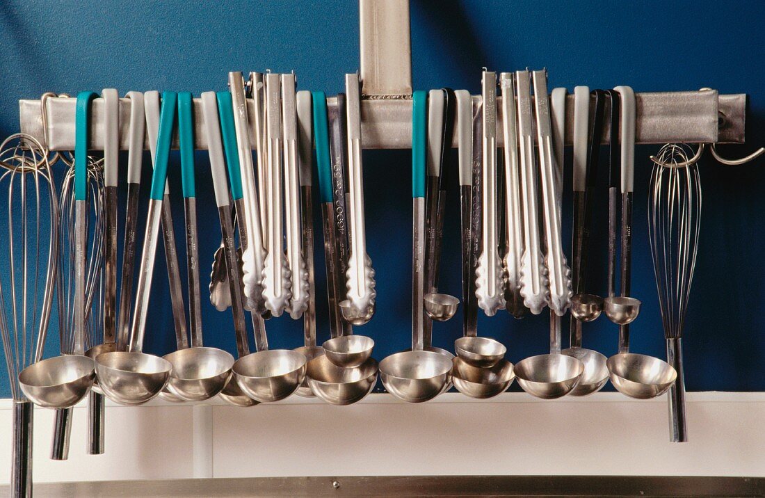 Ladles and other kitchen utensils hanging up