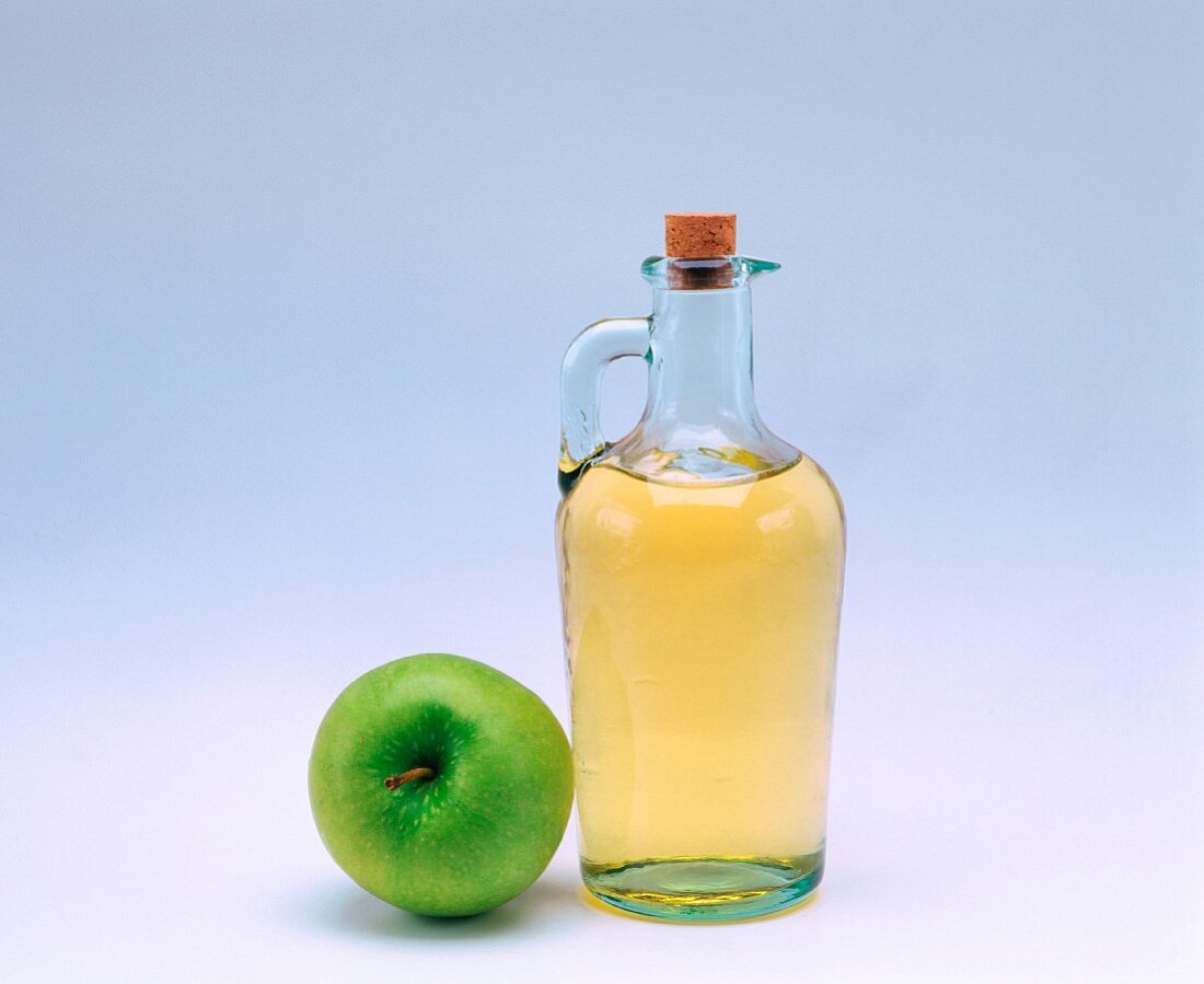 Cider vinegar and an apple