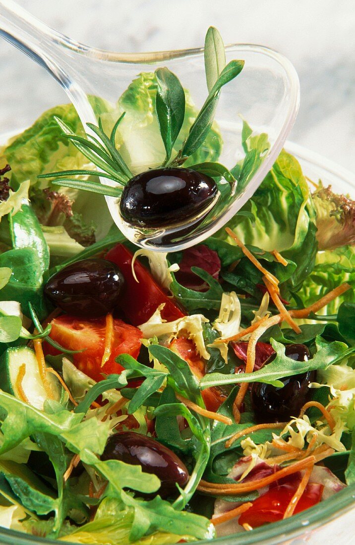 A mixed salad with olives
