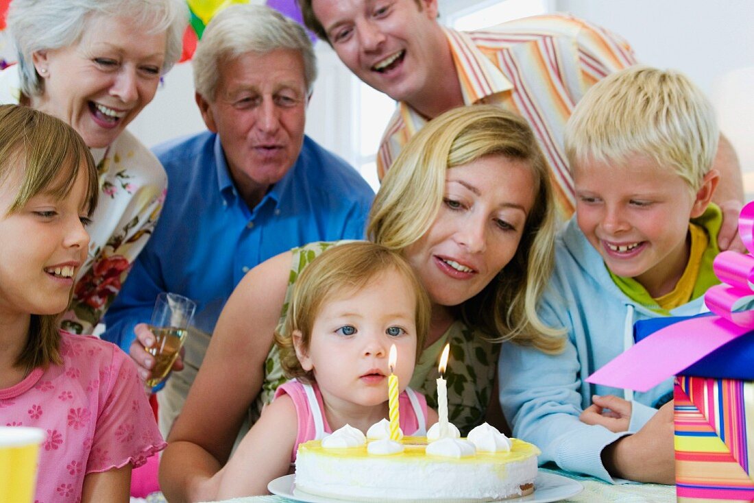 Family celebrating daughter's birthday
