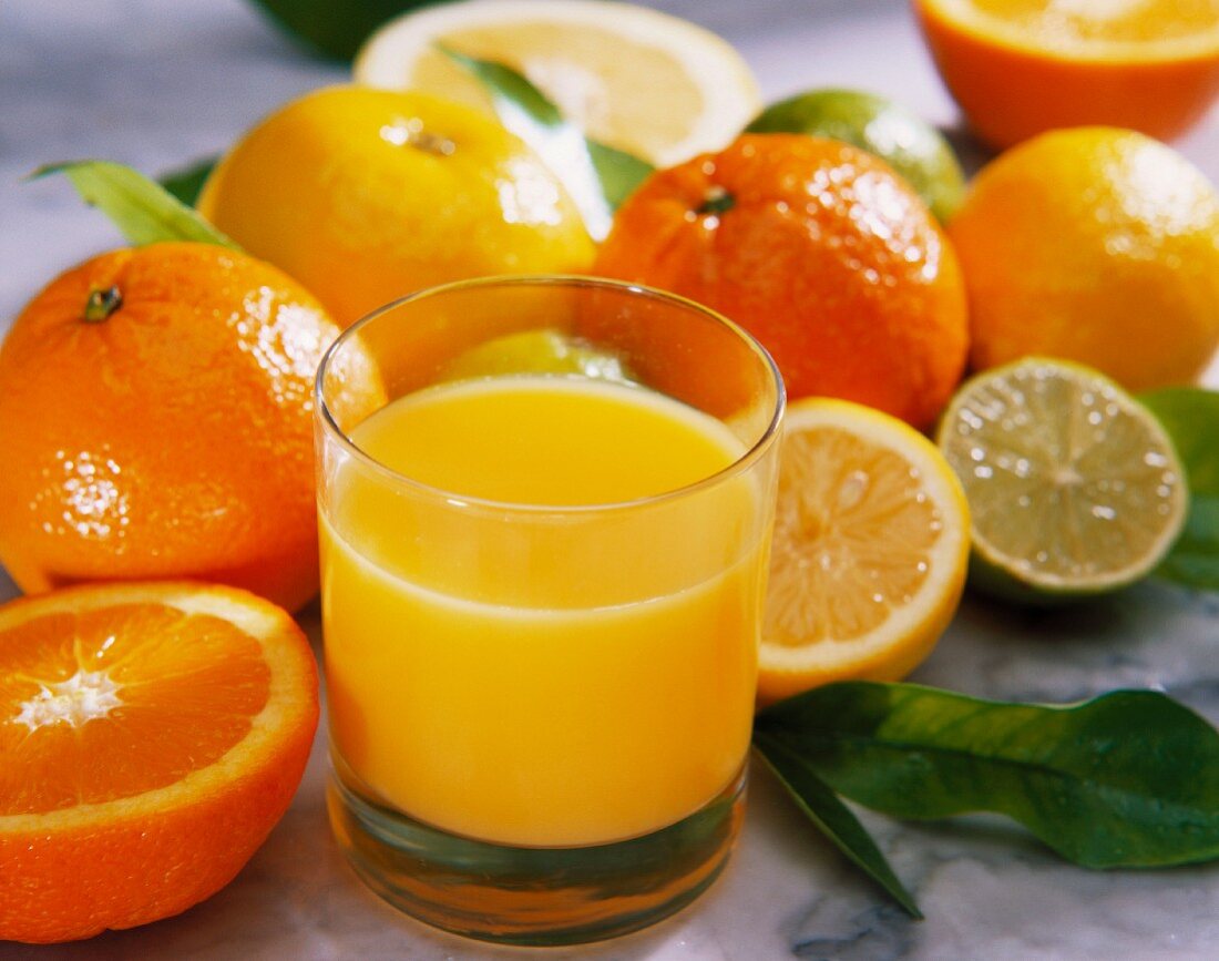 Freshly squeezed orange juice with citrus fruits