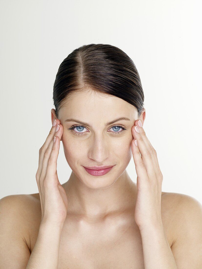 Woman massaging her temples