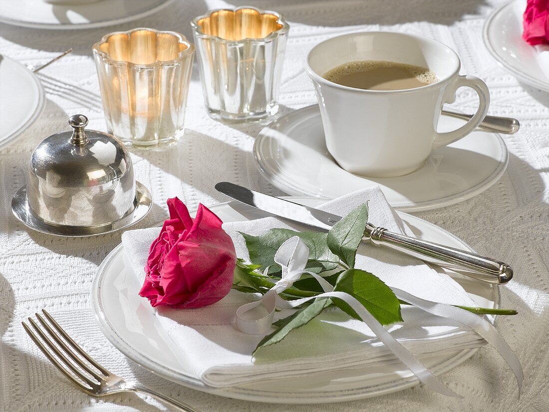 Coffee setting with red rose