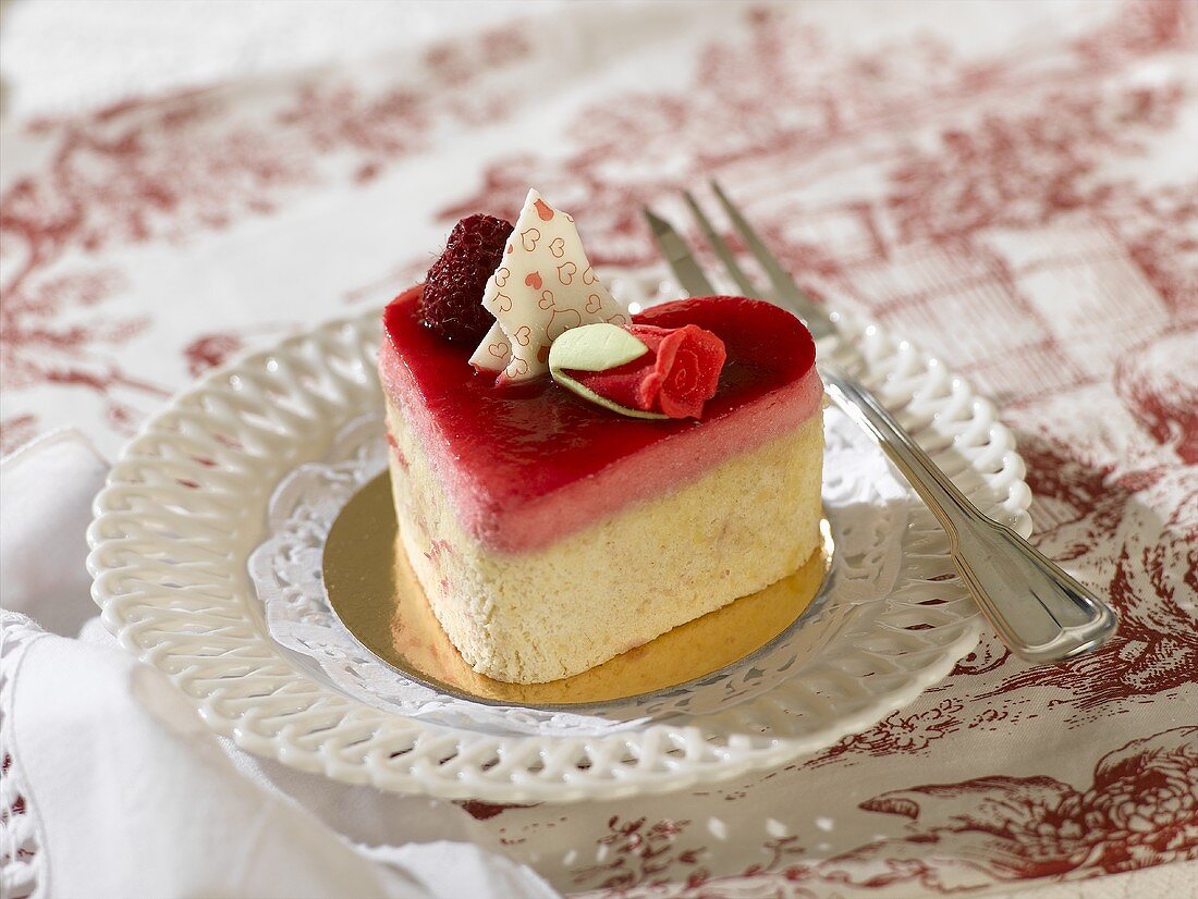 Small heart-shaped cake with raspberry